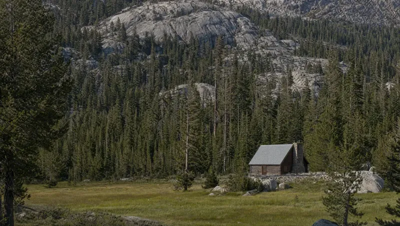 Alpine County, California: Red fir/lodgepole forest with granite slabs; cabin with metal roof by a small meadow