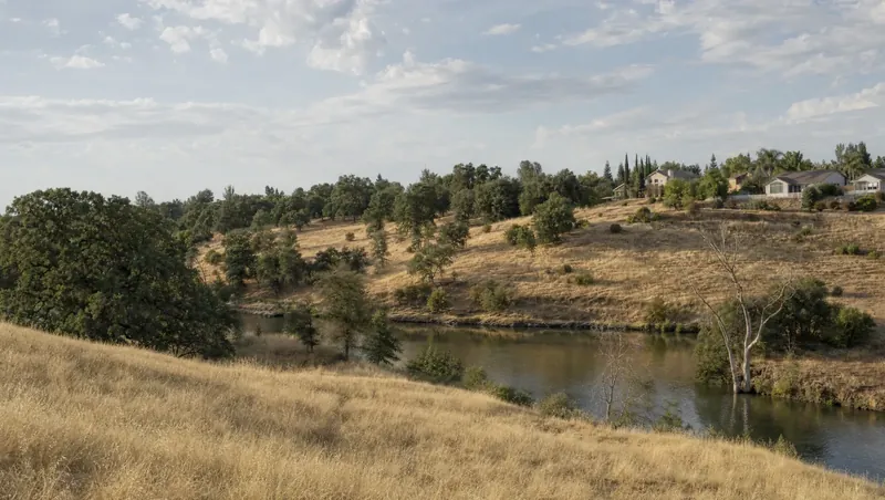 Sacramento County, California: River oak woodland and dry grassland; suburban homes bordering the open space