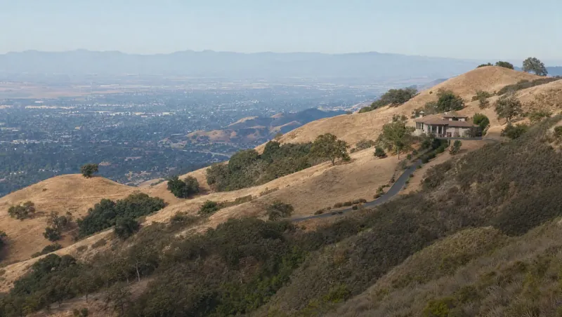 Santa Clara County, California: Golden oak-savanna foothills with chaparral; hillside home with long driveway above a hazy valley