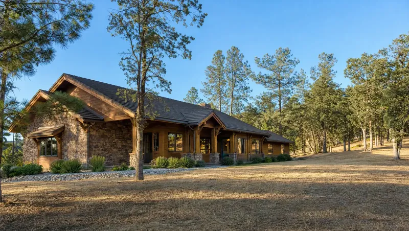 Ranch house in the California foothills with cleared defensible space around it